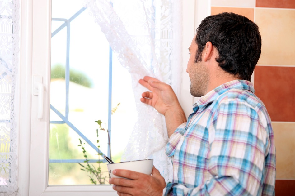 photodune-4788286-man-looking-out-window-s