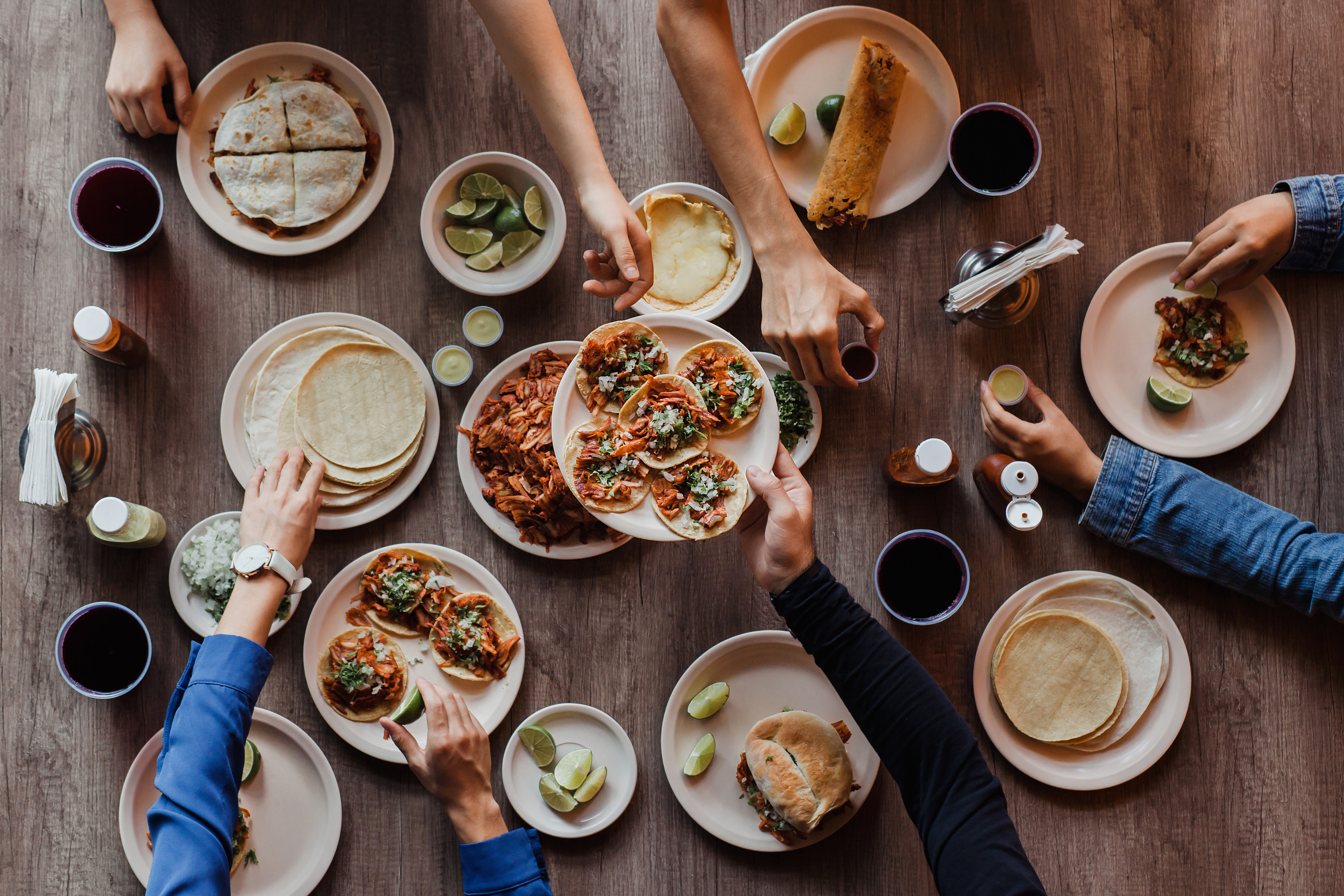 Tacos al Pastor, Group of People eating in a Taqueria, Tacos top view