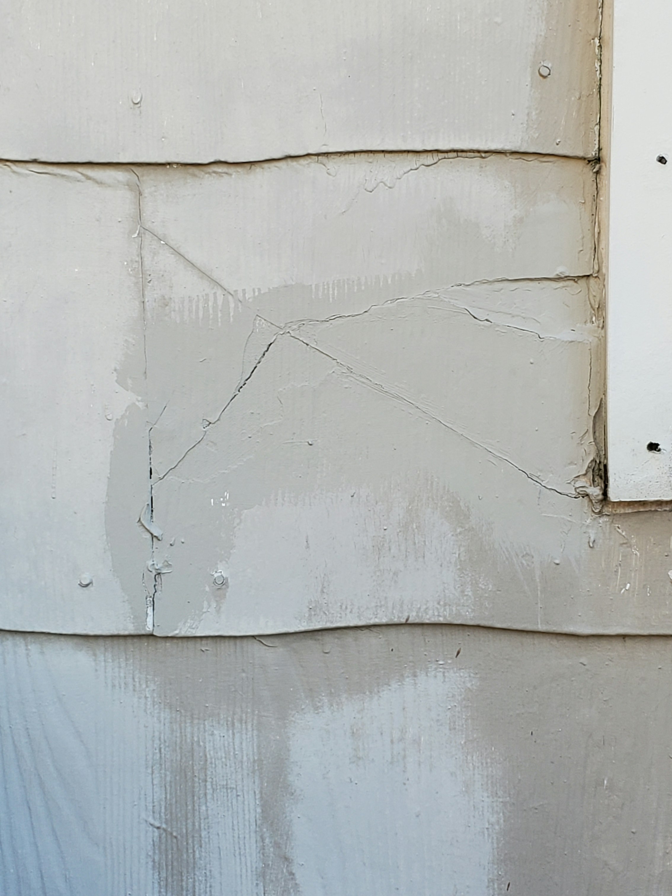 broken asbestos siding