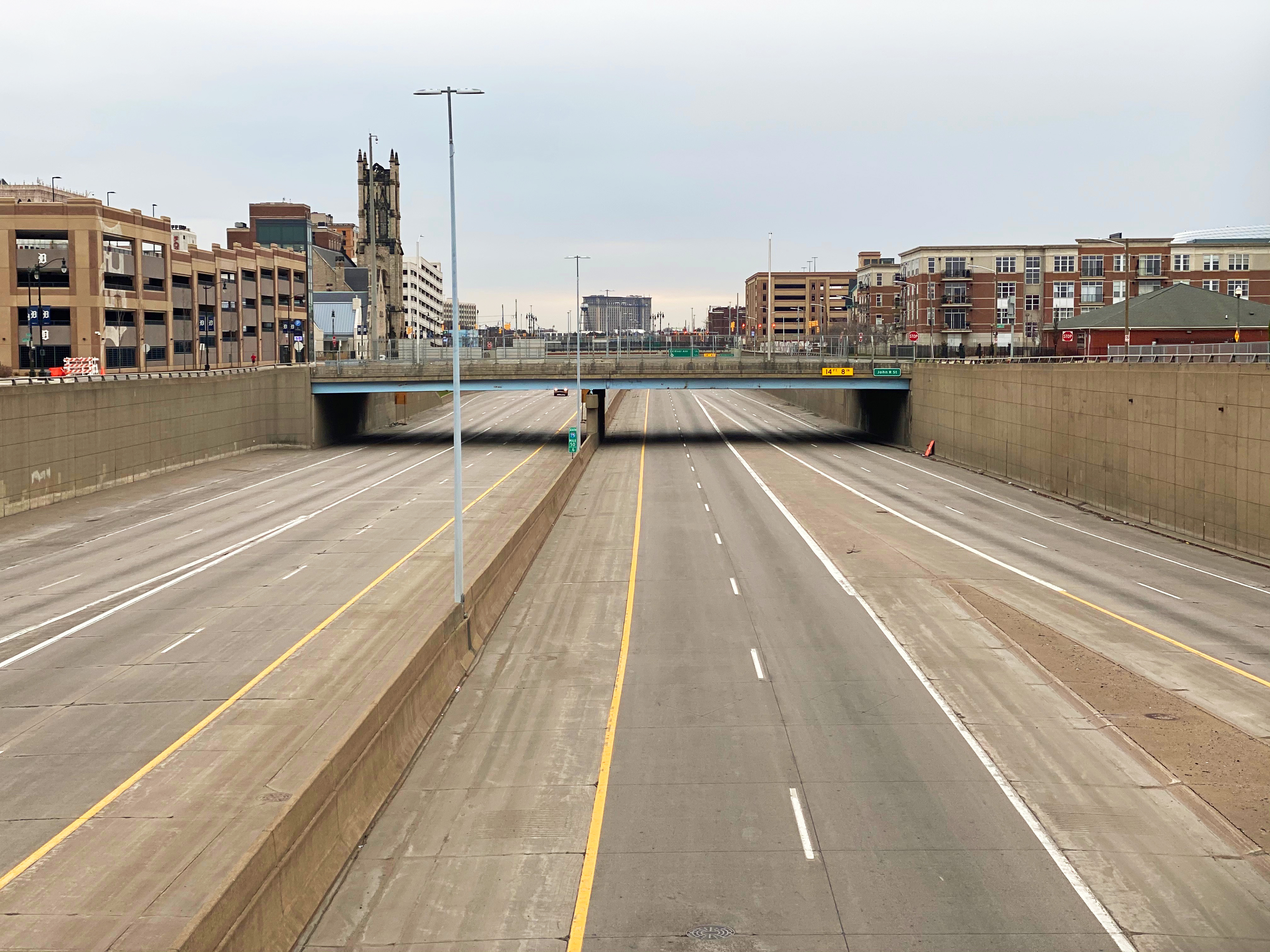 Image of empty road and underpass suggesting a vacant city